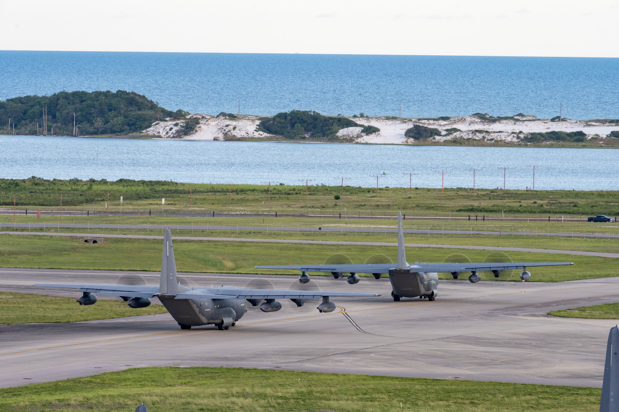 Two MC-130J Commando II aircraft from the 1st Special Operations Wing taxi to the runway at Hurlburt Field, Florida, Jul. 6, 2023. The 1st Special Operation Wing, especially postured for rapid intervention in any crisis or conflict, launched two MC-130Js in support of U.S. Southern Command to enhance collective readiness, capability and contribute to regional security in the Western Hemisphere.