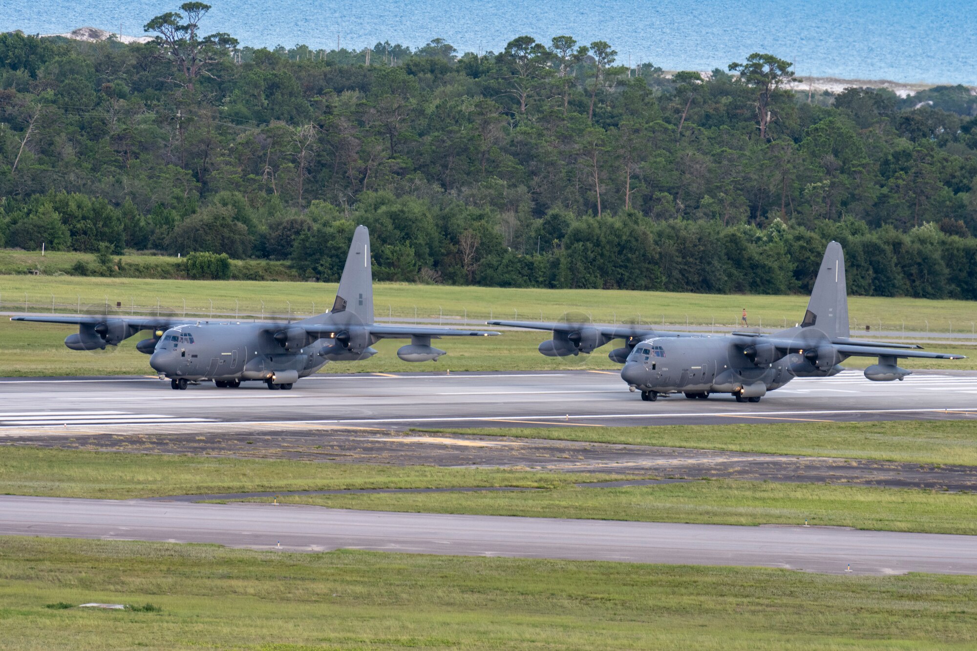 Two MC-130J Commando II aircraft from the 1st Special Operations Wing taxi to the runway at Hurlburt Field, Florida, Jul. 6, 2023. The 1st Special Operation Wing, especially postured for rapid intervention in any crisis or conflict, launched two MC-130Js in support of U.S. Southern Command to enhance collective readiness, capability and contribute to regional security in the Western Hemisphere