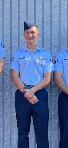 Airman 1st Class Cameron Poe poses at his graduation from the Naval School Explosive Ordnance Disposal in Eglin, Florida.