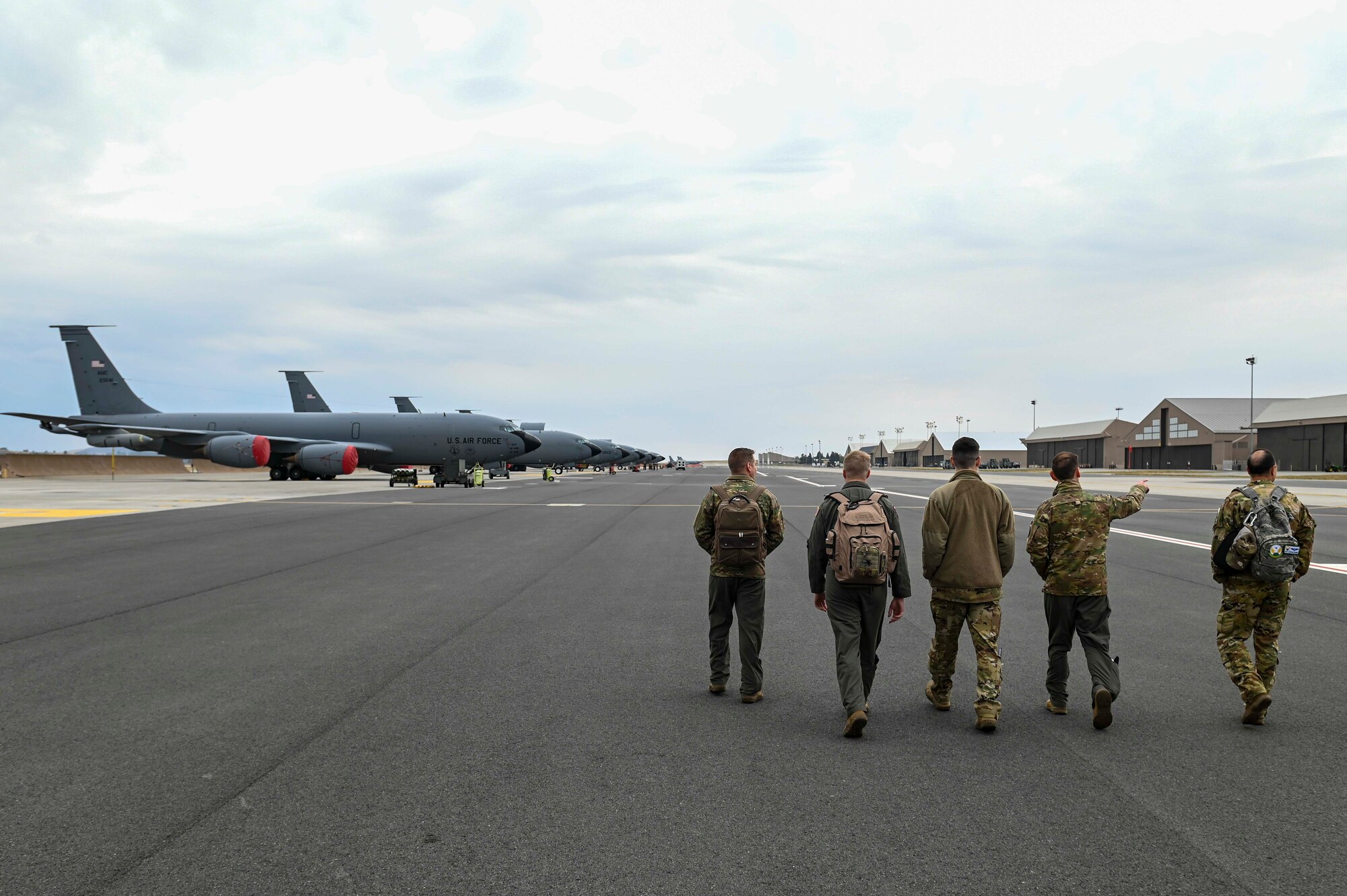 Airman walk towards a KC-135 Stratotanker