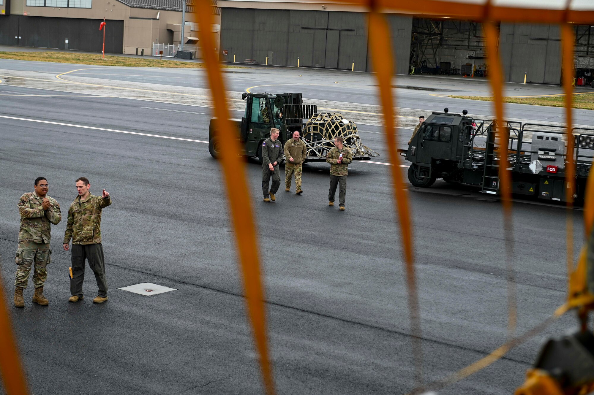 Airmen prep a KC-135 Stratotanker to receive cargo