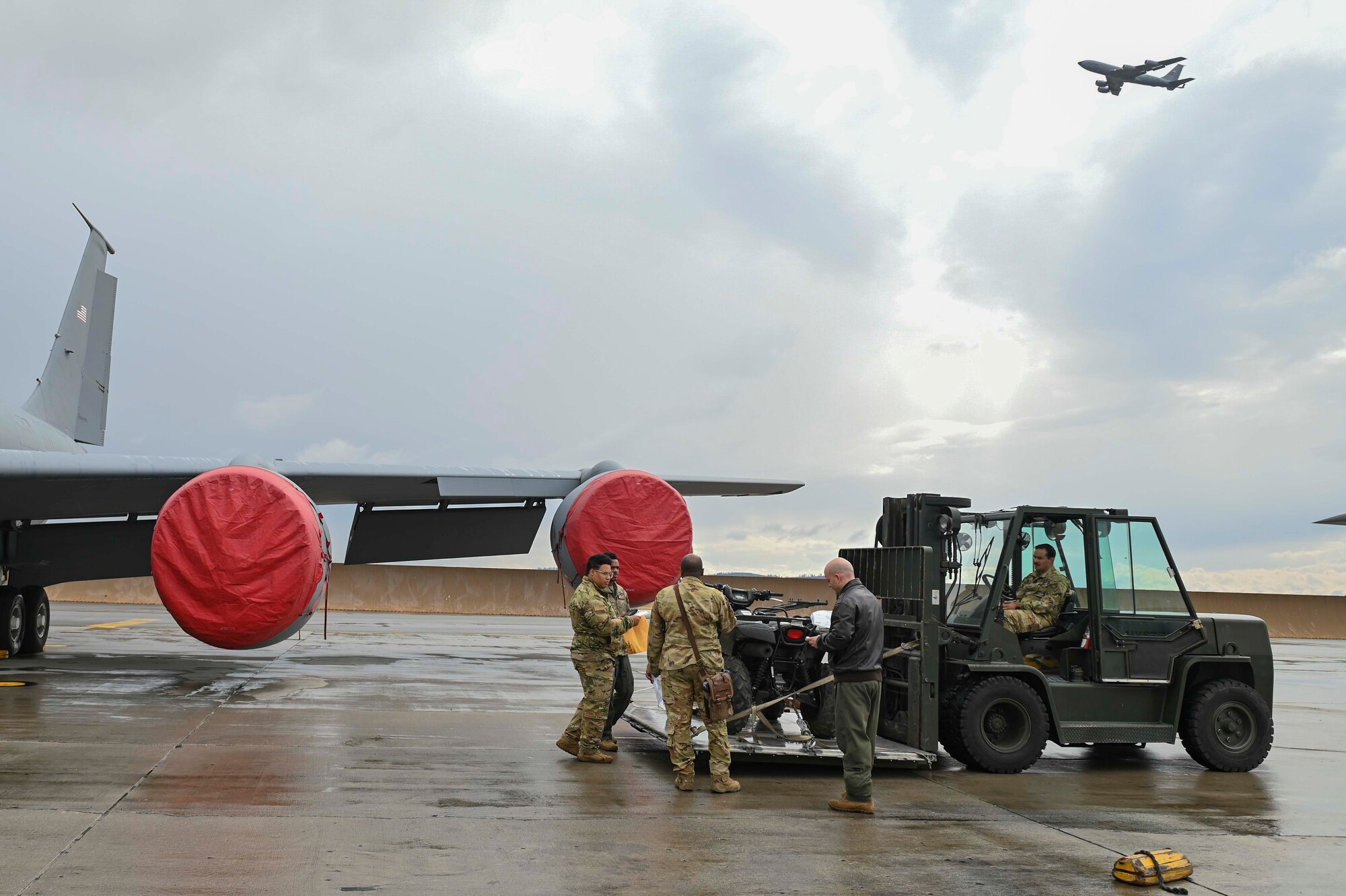 Airmen inspect cargo on a forklift