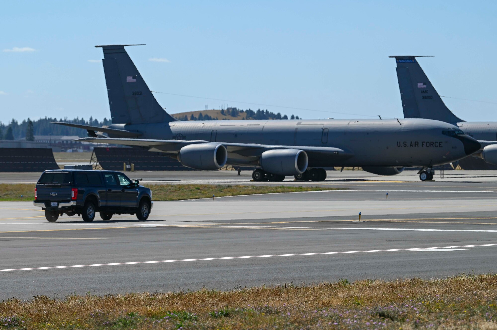 A vehicle drives to a KC-135
