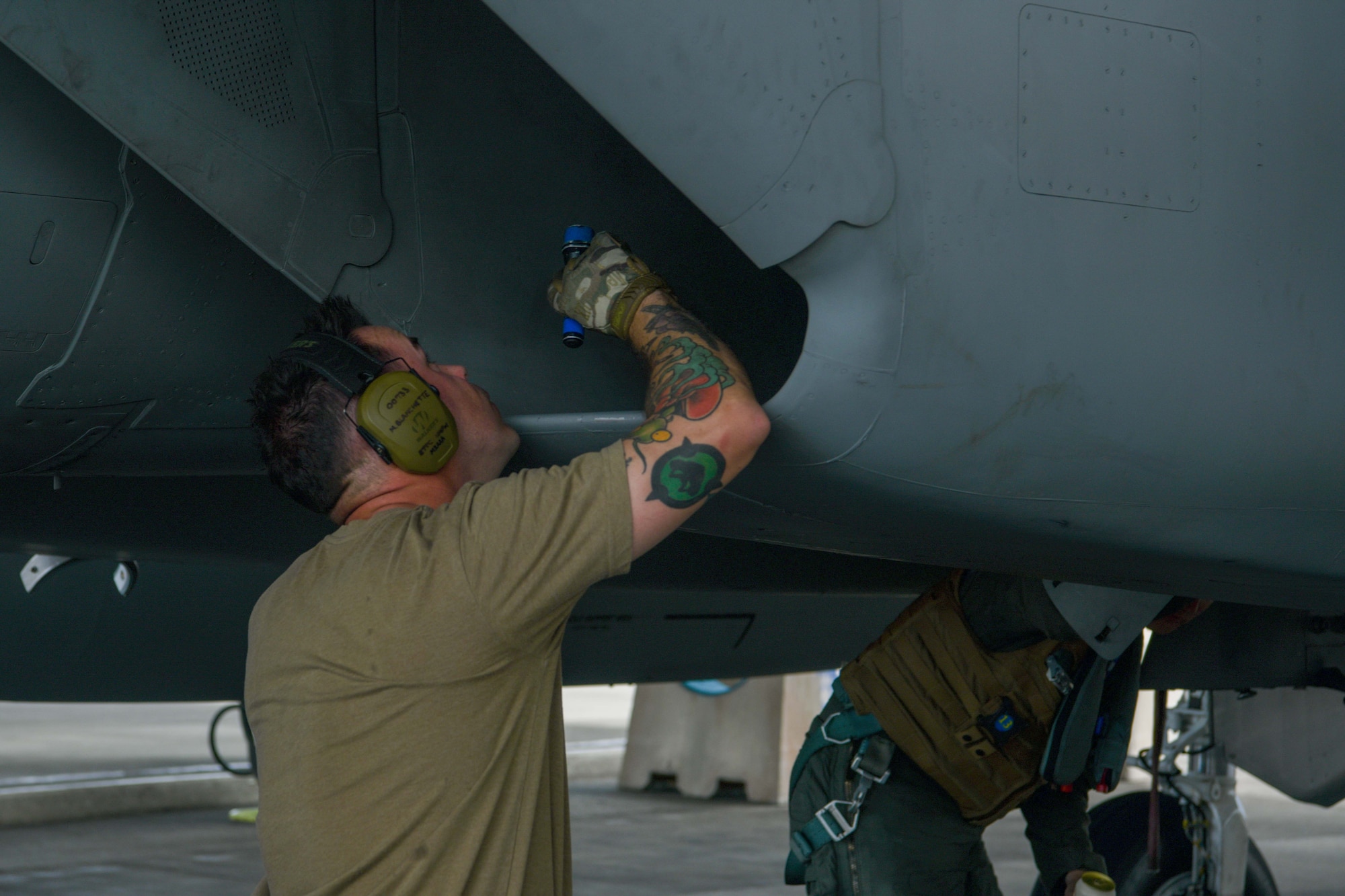 Crew chief completes a post flight check of an F-15C Eagle.