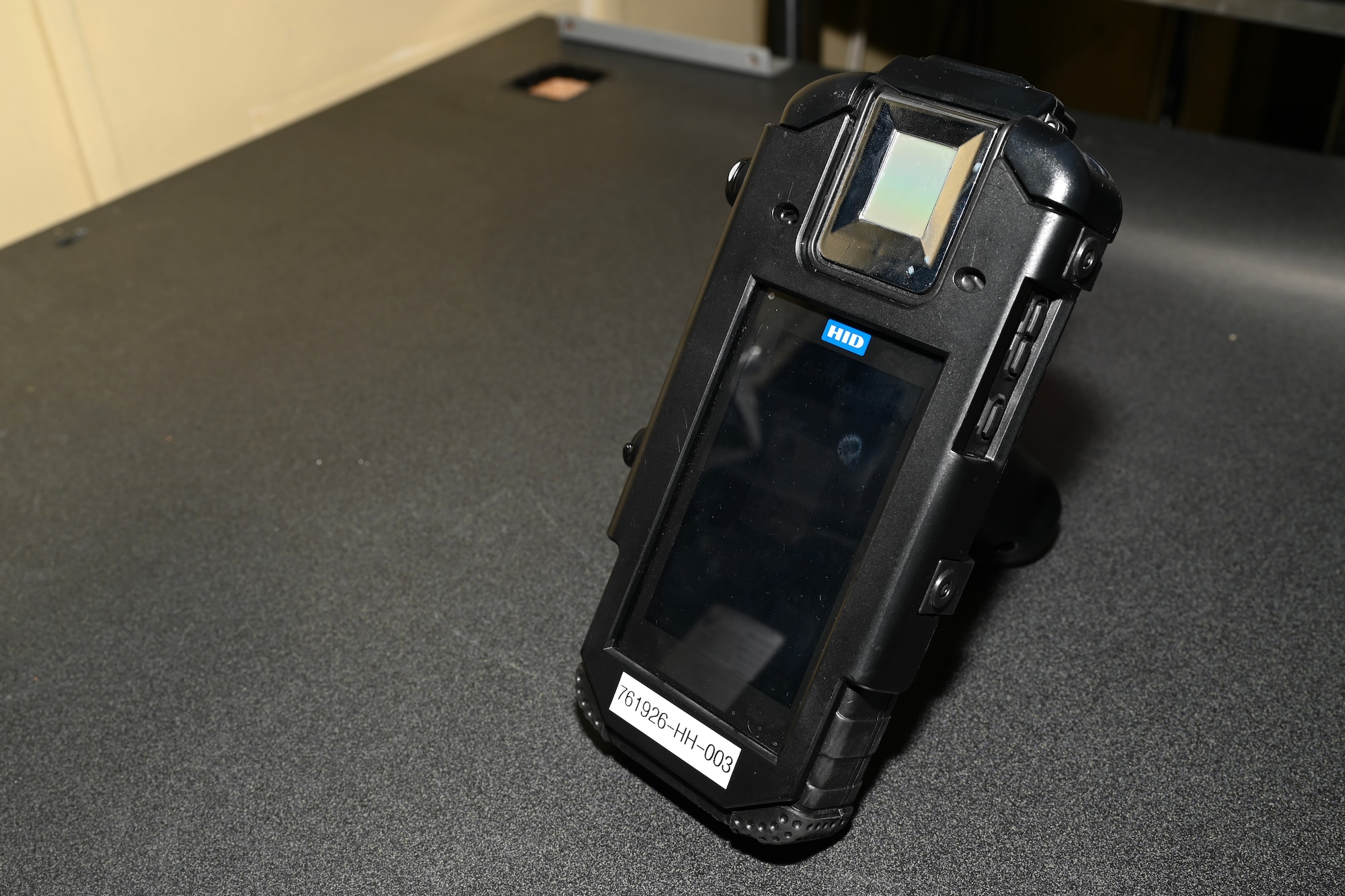 A Defense Biometric Identifications System scanner is placed on a table