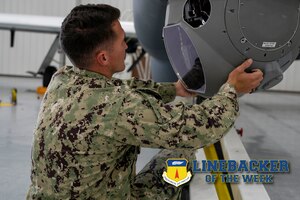 U.S. Navy Petty Officer 2nd Class Kaimi Scott, an aviation electronics technician assigned to the Unmanned Patrol Squadron (VUP) 19, works on a MQ-4C Triton aircraft at Andersen Air Force Base, Guam, Sept. 27, 2023. The Team Andersen Linebacker of the Week recognizes outstanding enlisted, officer, civilian and total force personnel who have had an impact on achieving Team Andersen’s mission, vision and priorities. (U.S. Air Force photo by Airman 1st Class Emily Saxton)