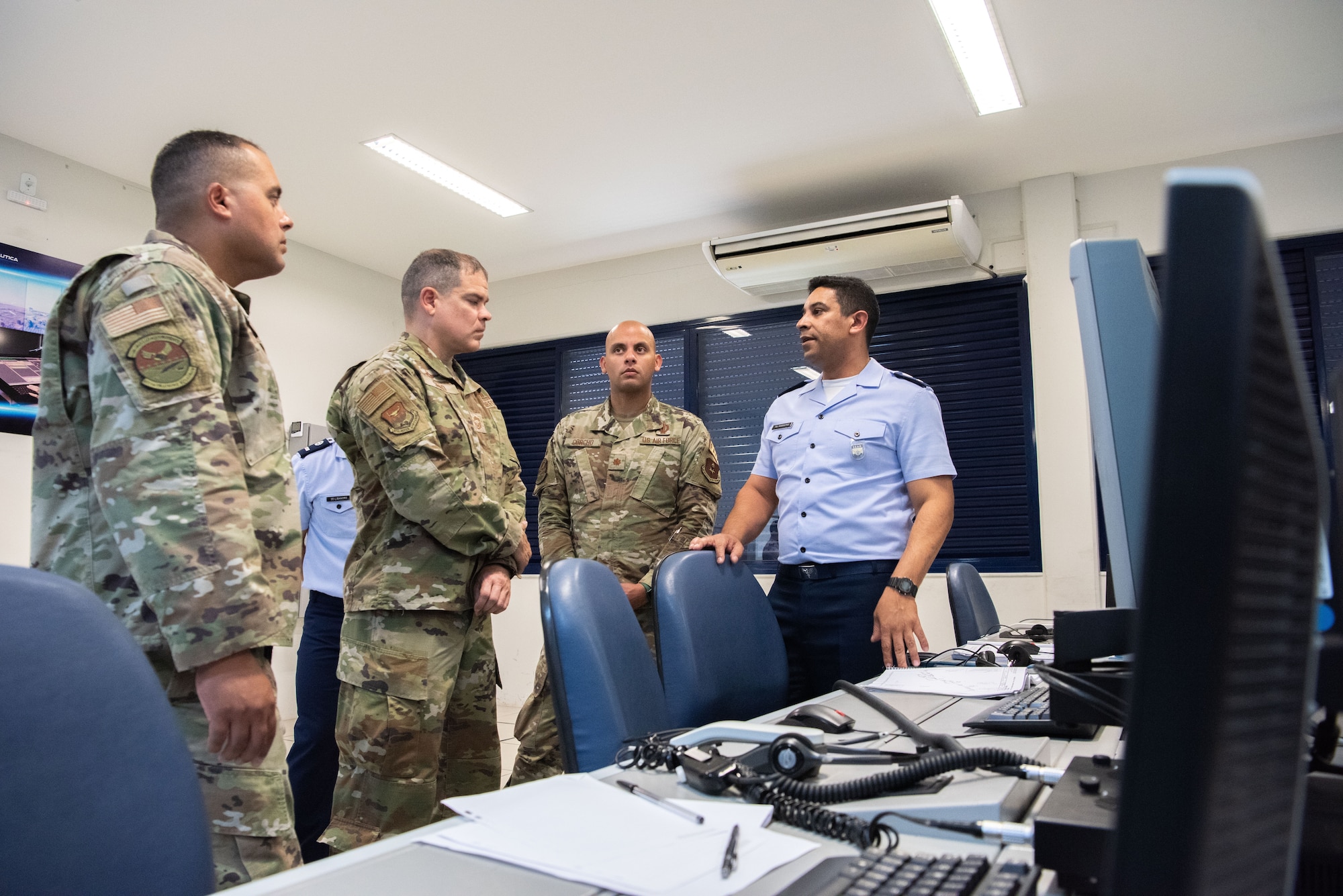 Senior Master Sgt. Victor Alvarez, Senior Enlisted Leader of the 837th Training Squadron, Chief Master Sgt. Yusef Saad, IAAFA’s Senior Enlisted Leader, and Maj. Elias Corcho, Director of Operations, of the 837 TRS stand during a tour of the Aeronautics Specialist School in Sao Paolo, Brazil, Aug. 22, 2023. IAAFA led the professional development subject matter expert exchange with the Brazilian Air Force. It was the first visit of its kind in over a decade. (U.S. Air Force photo by Vanessa R. Adame)