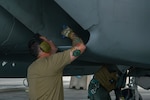 U.S. Air Force Tech. Sgt. Matt Blanchette, 104th Aircraft Maintenance Squadron crew chief, completes a post flight check of an F-15C Eagle at Kadena Air Base, Japan, Oct. 3, 2023. As the 18th Wing continues the phased return of Kadena’s fleet of Eagles, the Department of Defense will maintain a steady-state fighter presence in the Indo-Pacific region  by temporarily deploying aircraft to maintain deterrence capabilities and added flexibility in a dynamic theater. (U.S. Air Force photo by Airman 1st Class Catherine Daniel)