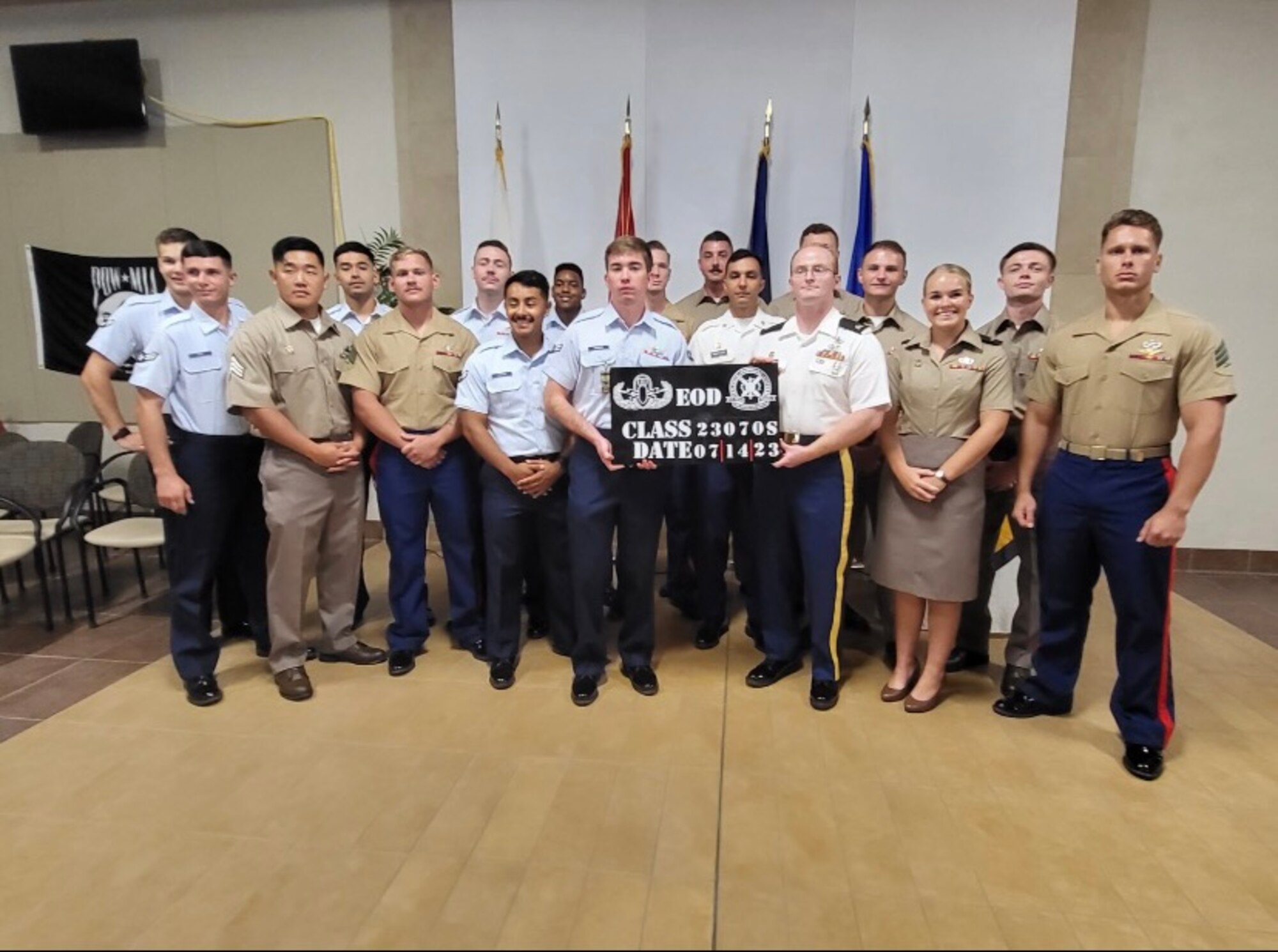 Airman First Class Owen Sanders stands with his graduating class at the Navy School of Explosive Ordnance Disposal at Eglin, Florida.