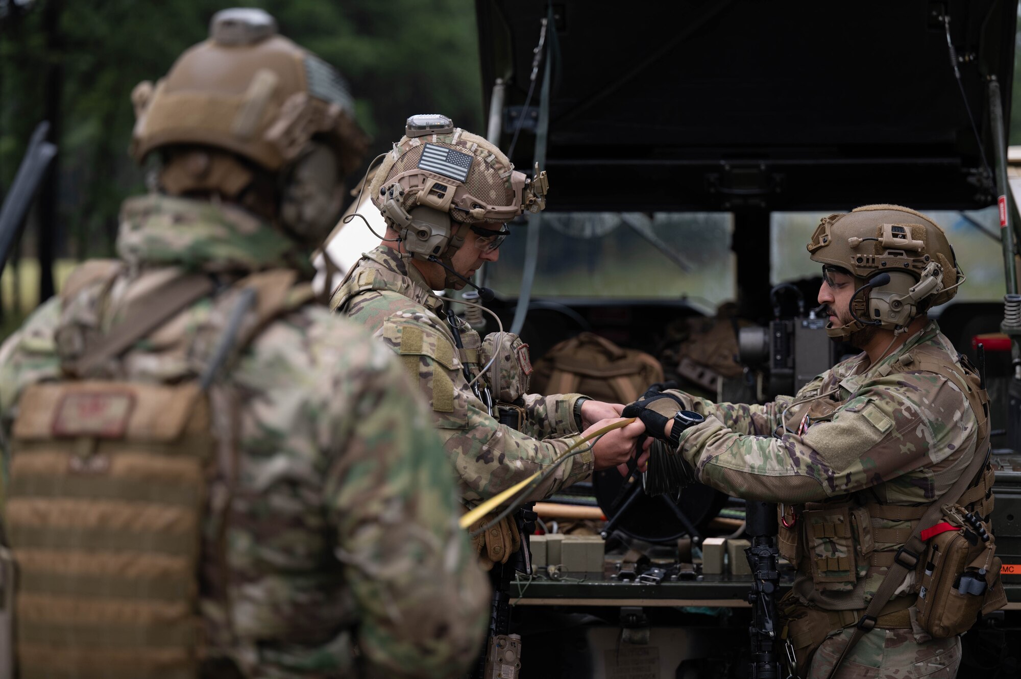 U.S. Air Force Airmen assigned to Joint Base McGuire-Dix-Lakehurst, explosive ordnance disposal technicians from the 87th Civil Engineer Squadron, prepare to dispose of the training unexploded ordinance at Joint Base McGuire-Dix-Lakehurst, N.J., on Sept 26, 2023. The EOD technicians are trained to clear unexploded ordinance from an improvised flight line. (U.S. Air Force photo by Airman 1st Class Aidan Thompson)