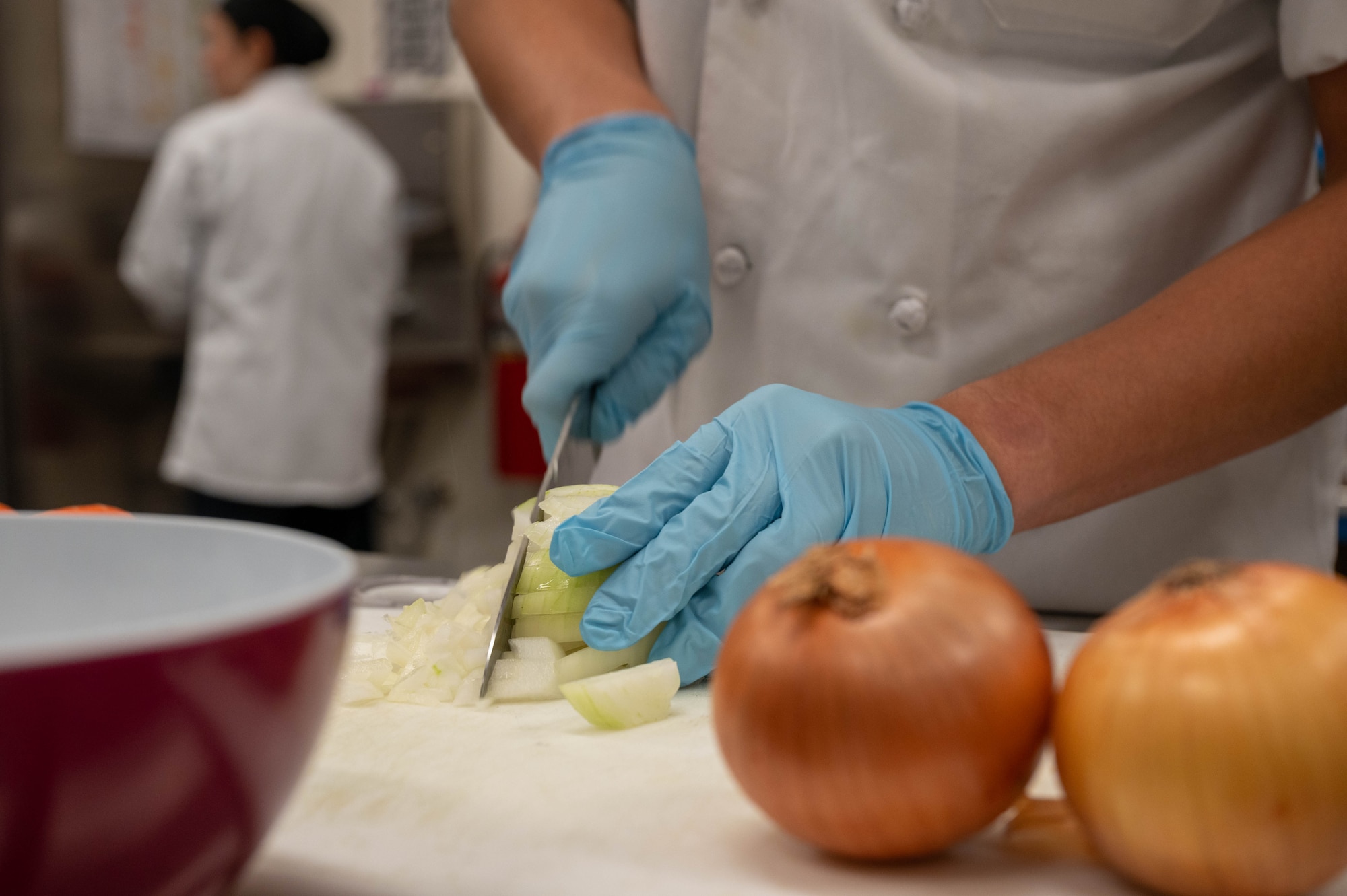 An Edgren Middle High School culinary student chops onions at Misawa Air Base, Japan, Sept. 22, 2023.