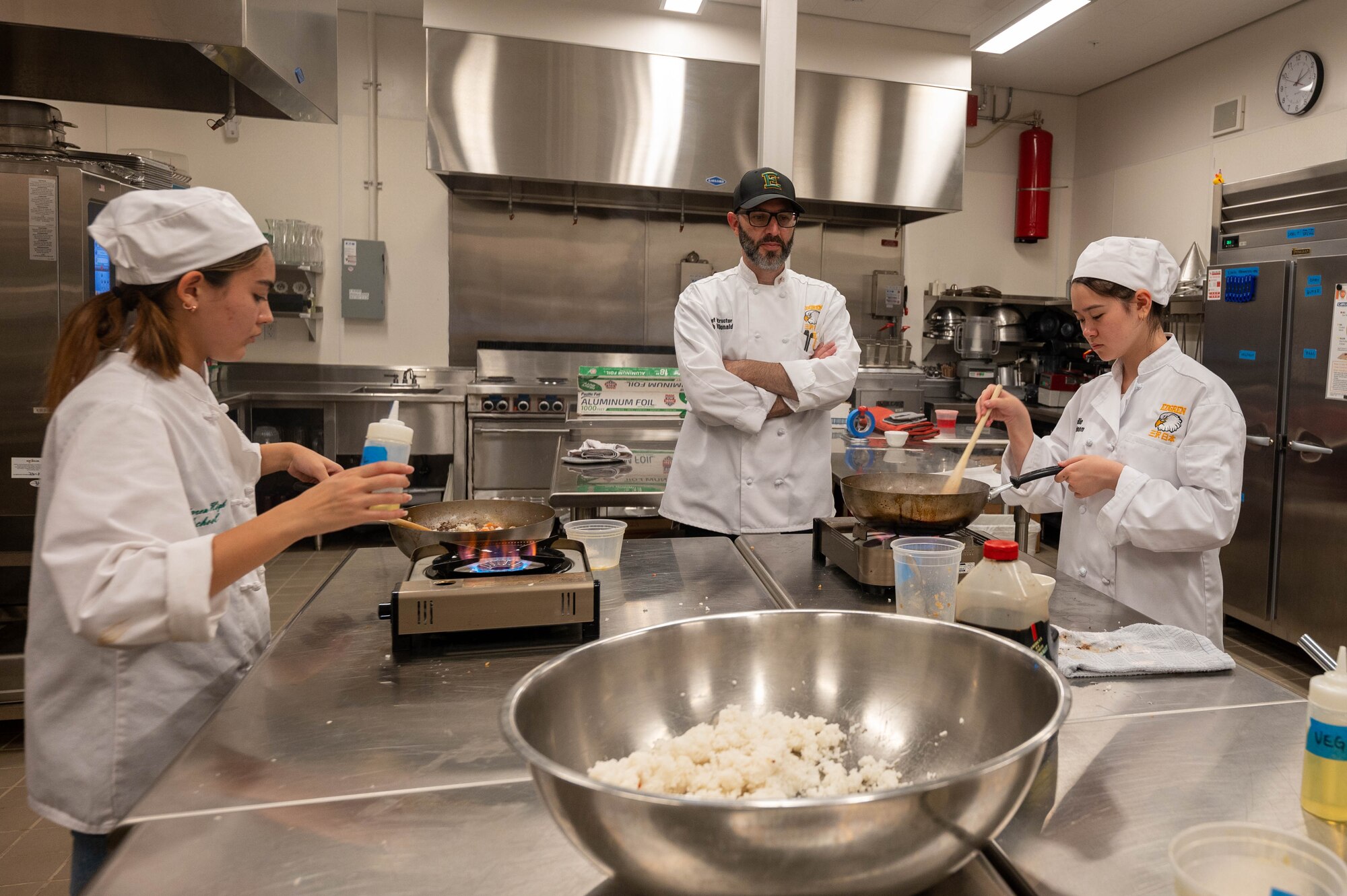 Rob McDonald, Edgren Middle High School culinary instructor, supervises students cooking at Misawa Air Base, Japan, Sept. 24, 2023.