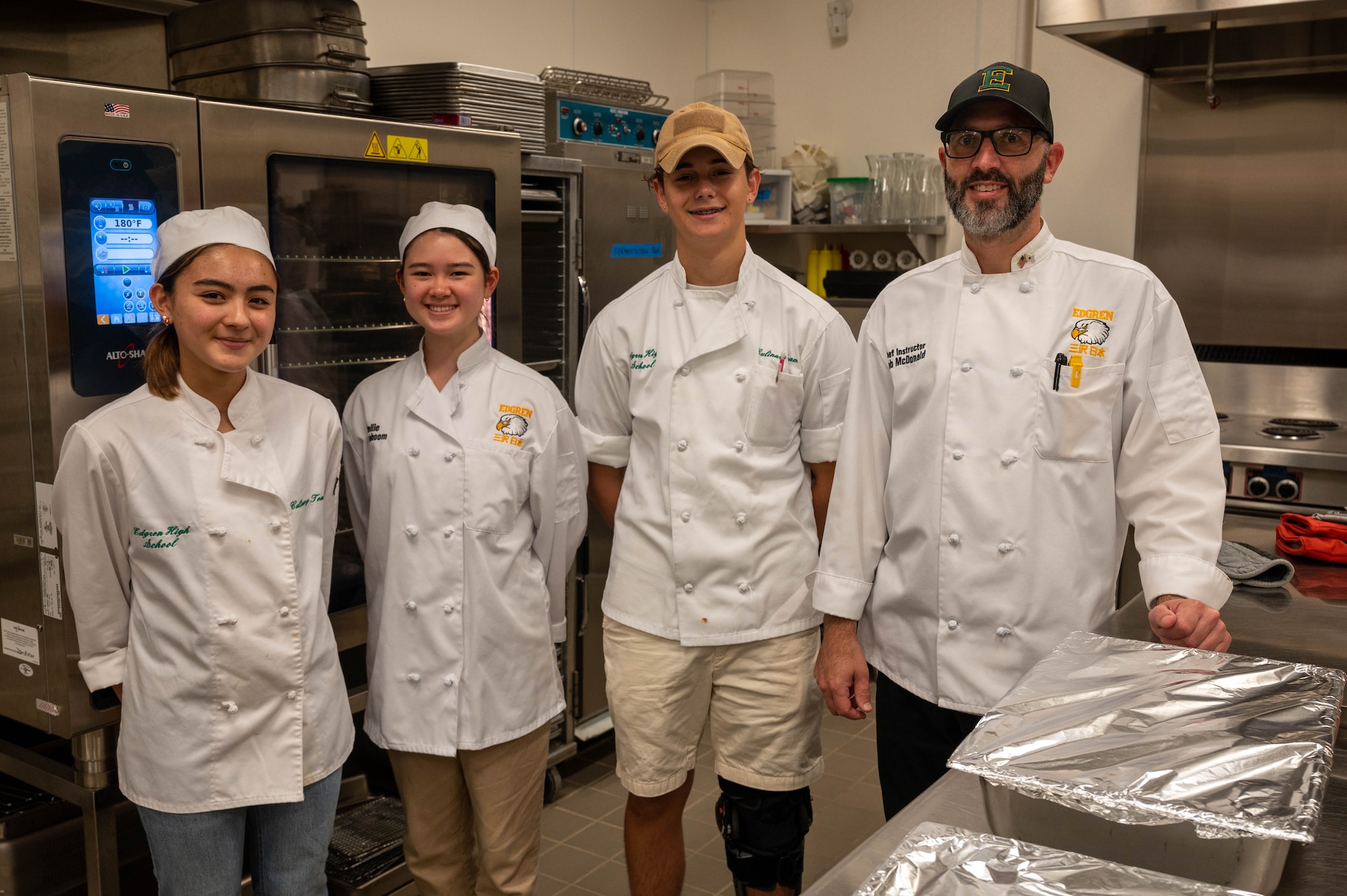 Rob McDonald, Edgren Middle High School culinary instructor, and his students pose together at Misawa Air Base, Japan, Sept. 24, 2023.