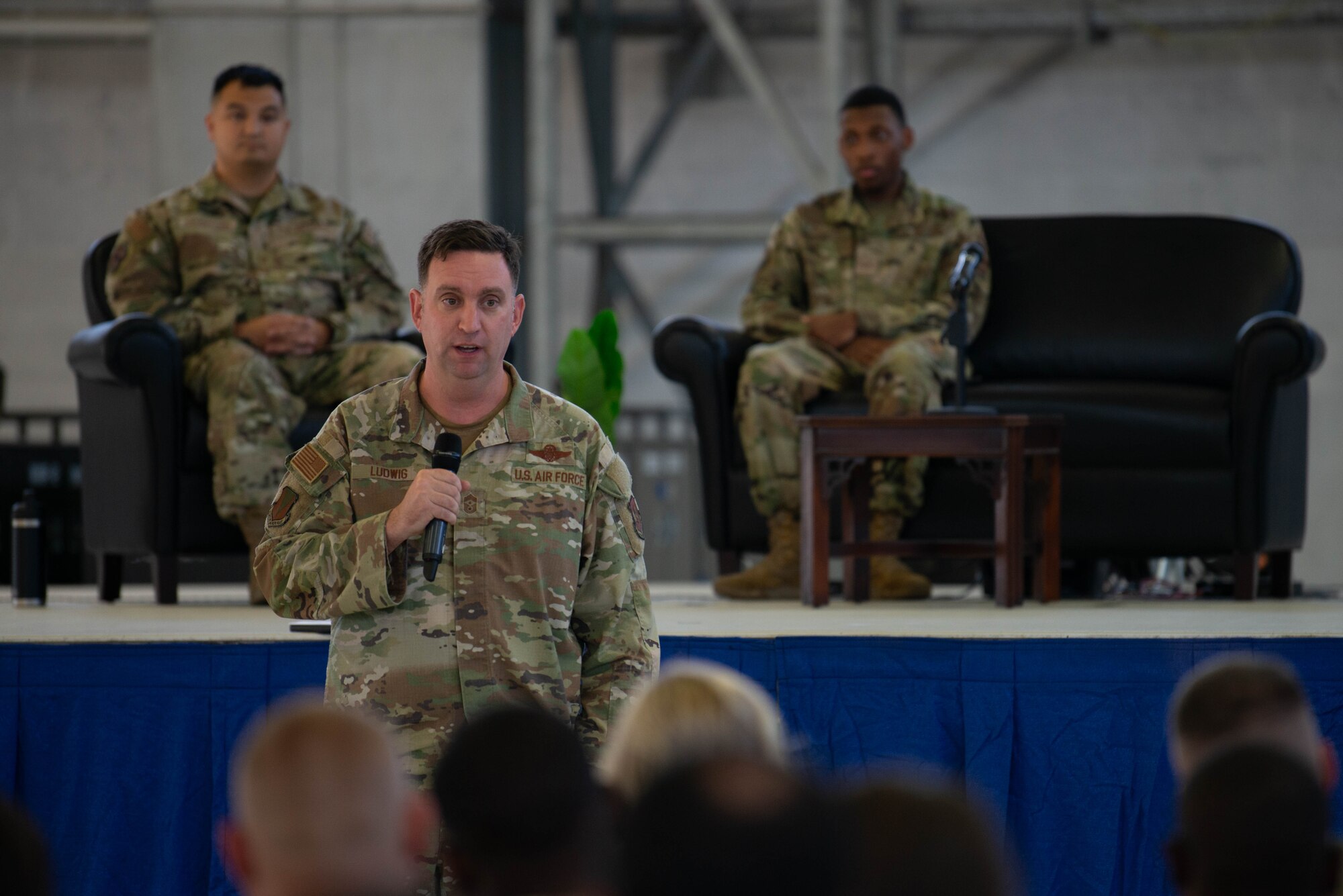 Wing command chief gives remarks at the beginning of a storytellers event