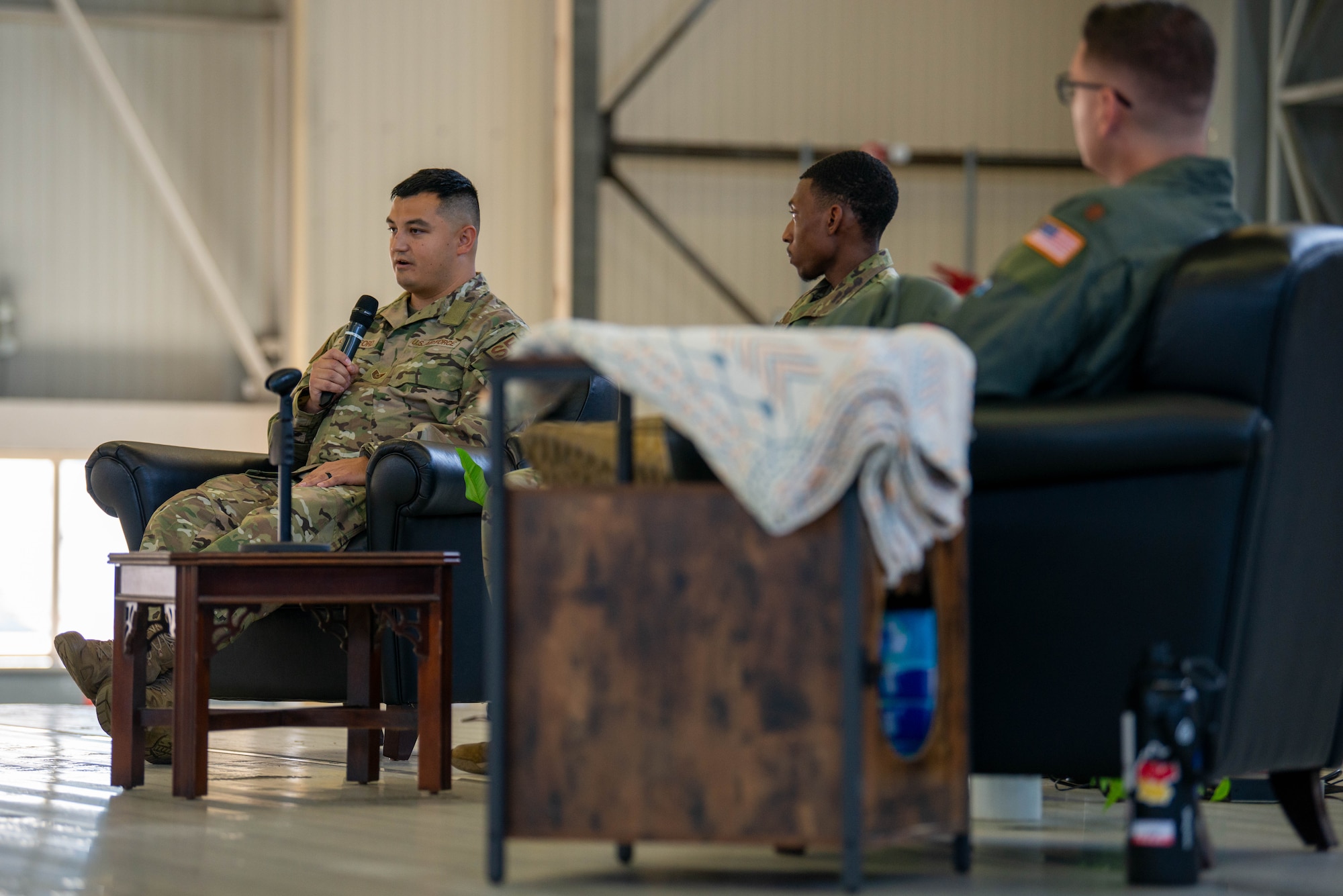 An Airman shares his story during a storytellers event