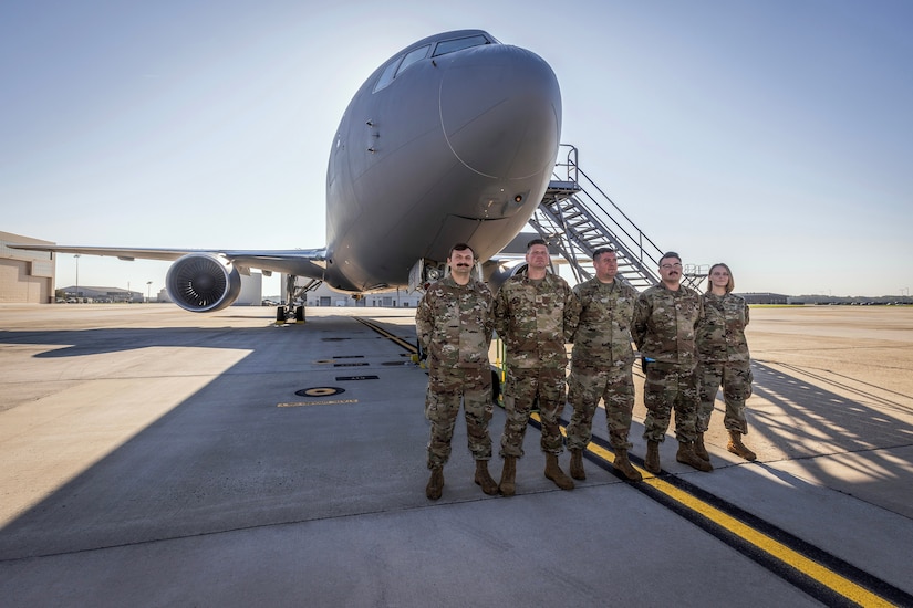 U.S. Air Force crew chiefs, left to right, Staff Sgt. Jesse Scala, Master Sgt. George Ruczynski, Tech. Sgt. Leif Eikrem, Senior Airman Robert Cort, and Master Sgt. Brittany Bounds with the New Jersey Air National Guard’s 108th Wing’s 141st Air Refueling Squadron pose for a group photo in front of a KC-46A Pegasus at Joint Base McGuire-Dix-Lakehurst, New Jersey, Oct. 3, 2023. All five, along with 12 pilots and boom operators, made 108th history when they flew their first sortie on the KC-46A. (New Jersey National Guard photo by Mark C. Olsen)