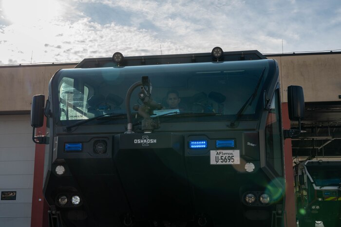 Senior Airman Cash performs diagnostics check on a fire truck.