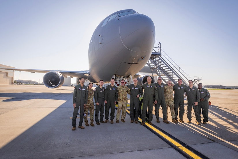 U.S. Air Force pilots and boom operators with the New Jersey Air National Guard’s 108th Wing’s 141st Air Refueling Squadron pose for a group photo in front of a KC-46A Pegasus at Joint Base McGuire-Dix-Lakehurst, New Jersey, Oct. 3, 2023. Left to right; pilot 1st Lt. Ashwin Deshpande; boom operators Staff Sgt. Nicole Stephenson and Tech. Sgt. Patrick Tracy; pilot Maj. Scott Mixdorf; boom operator Tech. Sgt. Bill Vigilante; pilots Maj. Bobby Pico, Col. Bill Liess, Lt. Col. Johann Hintz, and Capt. Brandon Johnson; boom operators Tech. Sgt. Christopher Howe, Master Sgt. Brian Kelly, and Master Sgt. Alissa Anderson. All 12, along with five crew chiefs, made 108th history when they flew their first sortie on the KC-46A. (New Jersey National Guard photo by Mark C. Olsen)