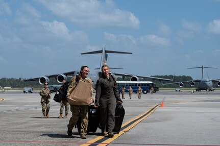 Airmen are welcomed home from deployment by family and friends on the flight line