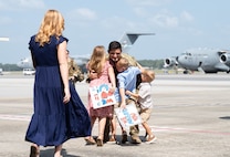 Airmen are welcomed home from deployment by family and friends on the flight line