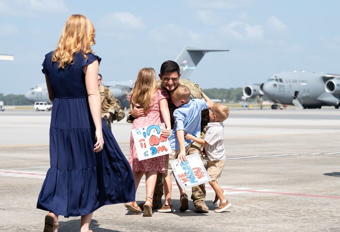 Airmen are welcomed home from deployment by family and friends on the flight line