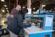 Sandhya Suresh, a civilian biomedical equipment technician, works alongside a teammate at the U.S. Army Medical Materiel Agency’s Medical Maintenance Operations Division at Tracy, California. The facility has embraced the “Together, Everyone Achieves More,” or T.E.A.M., philosophy and it’s been paying dividends throughout the workforce. (Katie Ellis-Warfield)