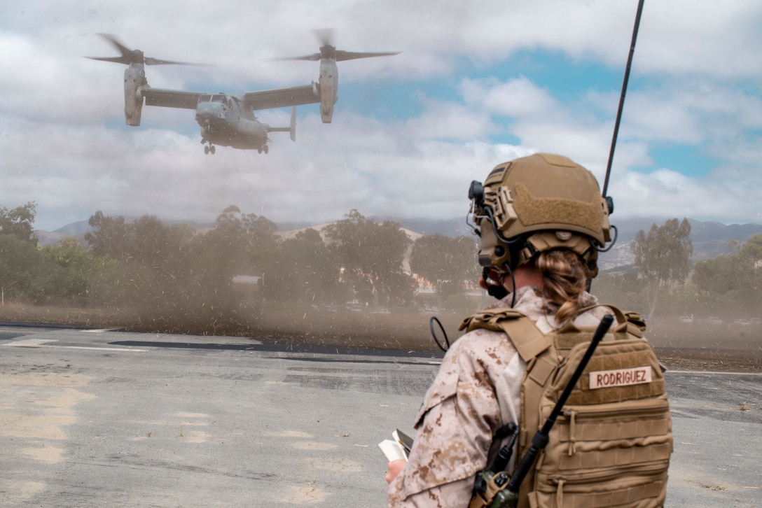 U.S. Marine Corps Sgt. Laura Rodriguez, an air traffic controller assigned to Marine Medium Tiltrotor Squadron 165, 15th Marine Expeditionary Unit, communicates with an MV-22B preparing to land at a forward refueling point in San Luis Obispo, California, during the 15th MEU’s Realistic Urban Training exercise, Aug. 23, 2023. RUT is a shore-based, MEU level exercise that provides an opportunity to train and execute operations as a Marine Air-Ground Task Force in urban environments.