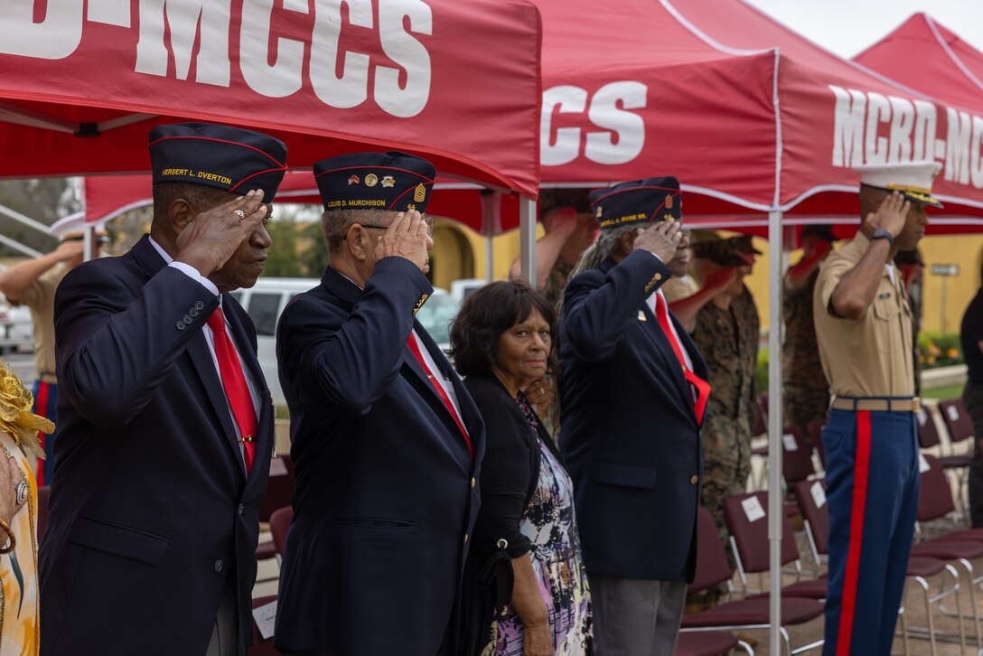 U.S. Marines with the Montford Point Marines Association, Chapter 44, salute during the National Anthem during an award and honors ceremony at Marine Corps Recruit Depot San Diego, Sept. 28, 2023. The Congressional Gold Medal was presented to Robin Rayford on behalf of her father, Master Sgt. Robert Lee Crittenden, who served in the Marine Corps from February 1946 to March 1965, making history as one of the 20,000 African Americans trained to become Marines at Montford Point Camp, located in Camp Lejeune, North Carolina. (U.S. Marine Corps photo by Cpl. Alexander O. Devereux)