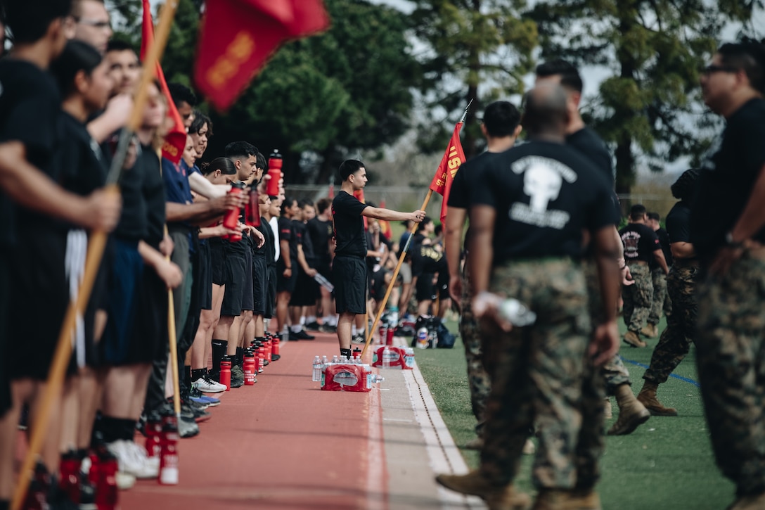 Future Marine Rodolfo Zuniga-Gutierrez, middle, a poolee with Recruiting Sub-Station Fairfield, Recruiting Station San Francisco, observes the festivities during the annual Battle of the Bay pool function in Hayward, California on April 8, 2023. The annual pool function is an opportunity for future Marines to build camaraderie, strengthen their commitment to the Marine Corps, and prepare for recruit training by competing in athletic competitions and receiving military related periods of instruction. (U.S. Marine Corps photo by Sgt. Alina Thackray)