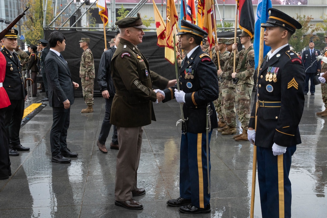 military leaders shake hands