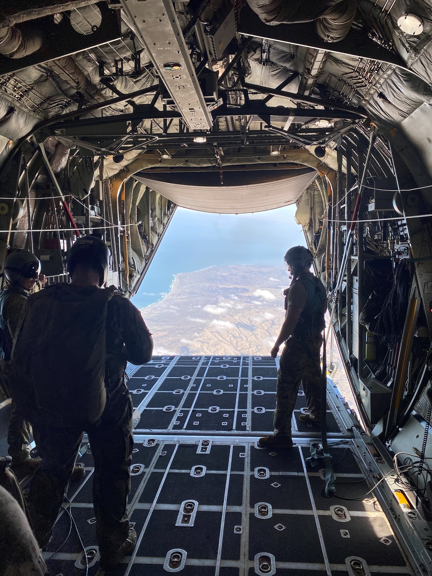 The 412th Operations Support Squadron Test Parachute Team from Edwards AFB gets ready to conduct a military freefall jump from a C-130 in Peru during the Resolute Sentinel 2023 exercise alongside Peruvian Armed Forces in July of 2023. Resolute Sentinel 2023, held in Peru, provides joint training and improved readiness for U.S. and partner nation civil engineers, medical professionals, and support personnel through humanitarian assistance activities. (U.S. Air Force photo by 412th OSS)