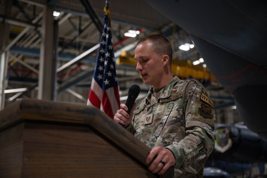 U.S. Air Force Tech. Sgt. Bryce Gex, 5th Aircraft Maintenance Squadron load standardization crew member, gives opening remarks for the 3rd Quarter Load Crew Competition at Minot Air Force Base, North Dakota Oct. 2, 2023. The competition is held quarterly to test readiness with load crews competing head-to-head in multiple categories such as a written test, equipment and uniform inspection and missile loading.