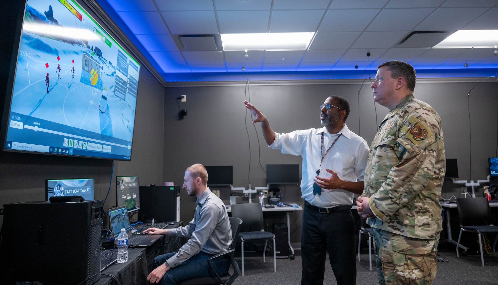 Lt. Gen. Tony Bauernfeind, AFSOC commander, is briefed on a new capability of the Extended Reality training on September 29, 2023 as a part of a larger XR training demonstration. With a comprehensive XR Training Framework in place, AFSOC is poised to transform its training methodologies, ensuring that Air Commandos are better prepared and equipped for strategic competition.  (U.S. Air Force photo by Staff Sgt. Caleb Pavao)