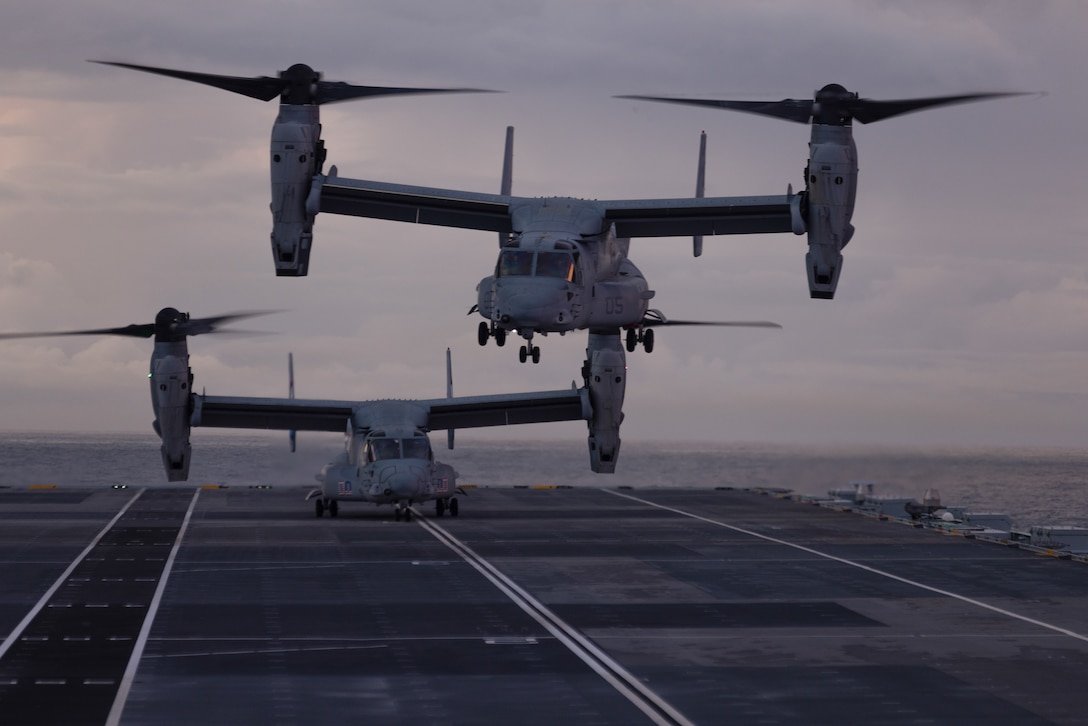 Two U.S. Marine Corps MV-22B Ospreys, assigned to Marine Medium Tiltrotor Squadron (VMM) 365, land and take off from HMS Prince of Wales, a Queen Elizabeth class aircraft carrier, near the coast of North Carolina, Sept. 28, 2023. VMM-365 conducted carrier qualifications aboard HMS Prince of Wales to maintain crew readiness and to showcase cooperation with allies and partners. VMM-365 is a subordinate unit of 2nd Marine Aircraft Wing, the aviation combat element of II Marine Expeditionary Force. (U.S. Marine Corps photo by Lance Cpl. Anakin Smith)