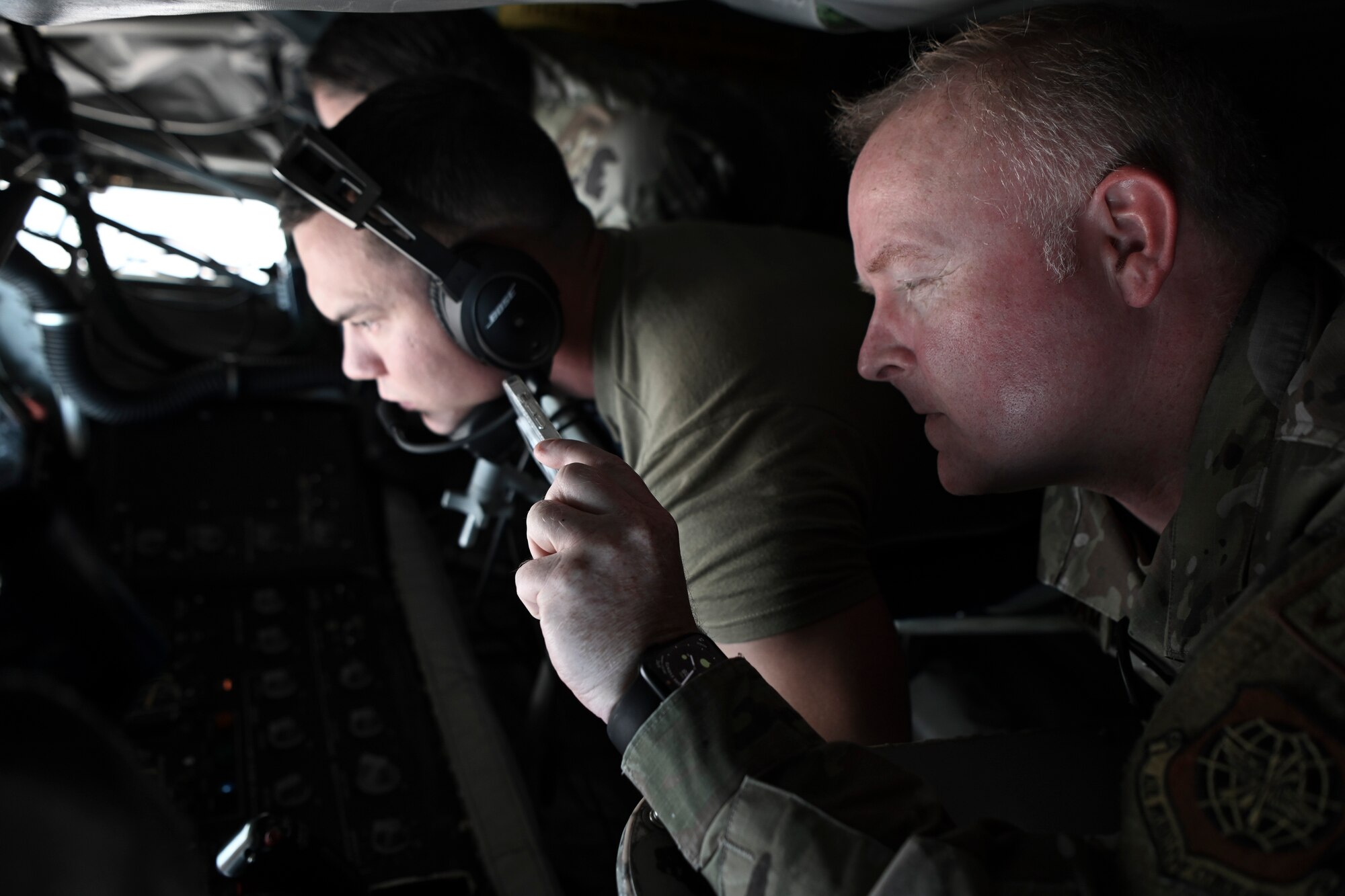 U.S. Air Force Col. Adam Bingham, 6th Air Refueling Wing commander, takes a video of a KC-135 Stratotanker refueling a B-1B Lancer assigned to Dyess Air Force Base, Texas, Sept. 28, 2023.