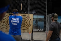 A Team Minot Airman competes in an axe throwing competition during the Norsk Hostfest Military Games in the city of Minot, North Dakota, Sept. 30, 2023. The competition was held as part of the Military Appreciation Day segment of the Norsk Hostfest.