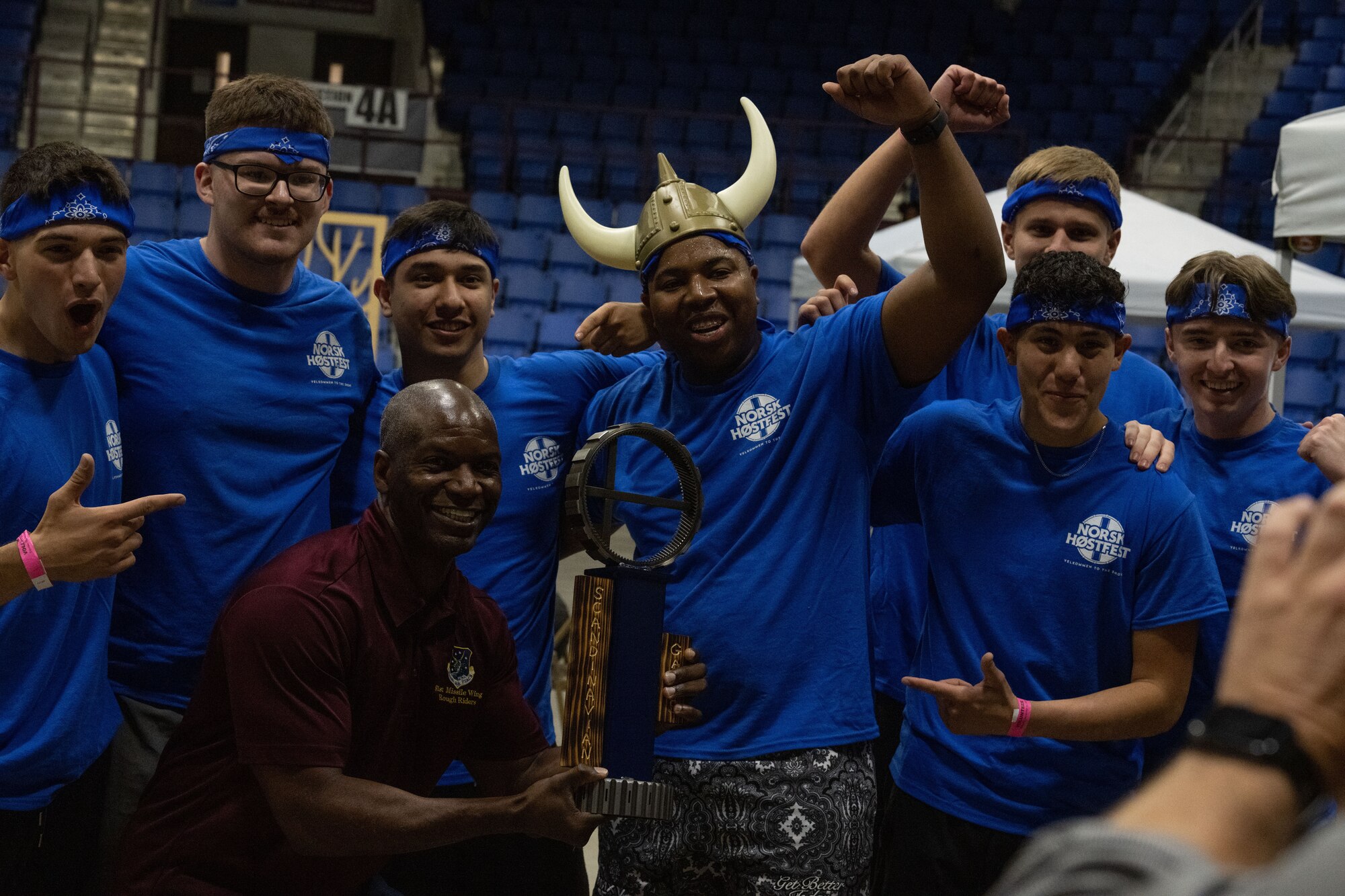 Col. Kenneth McGhee, 91st Missile Wing commander, poses for a group photo with the winners of the Norsk Hostfest Military Games during Norsk Hostfest in the city of Minot, North Dakota, Sept. 30, 2023. The competition took place during the Military Appreciation Day portion of Norsk Hostfest.