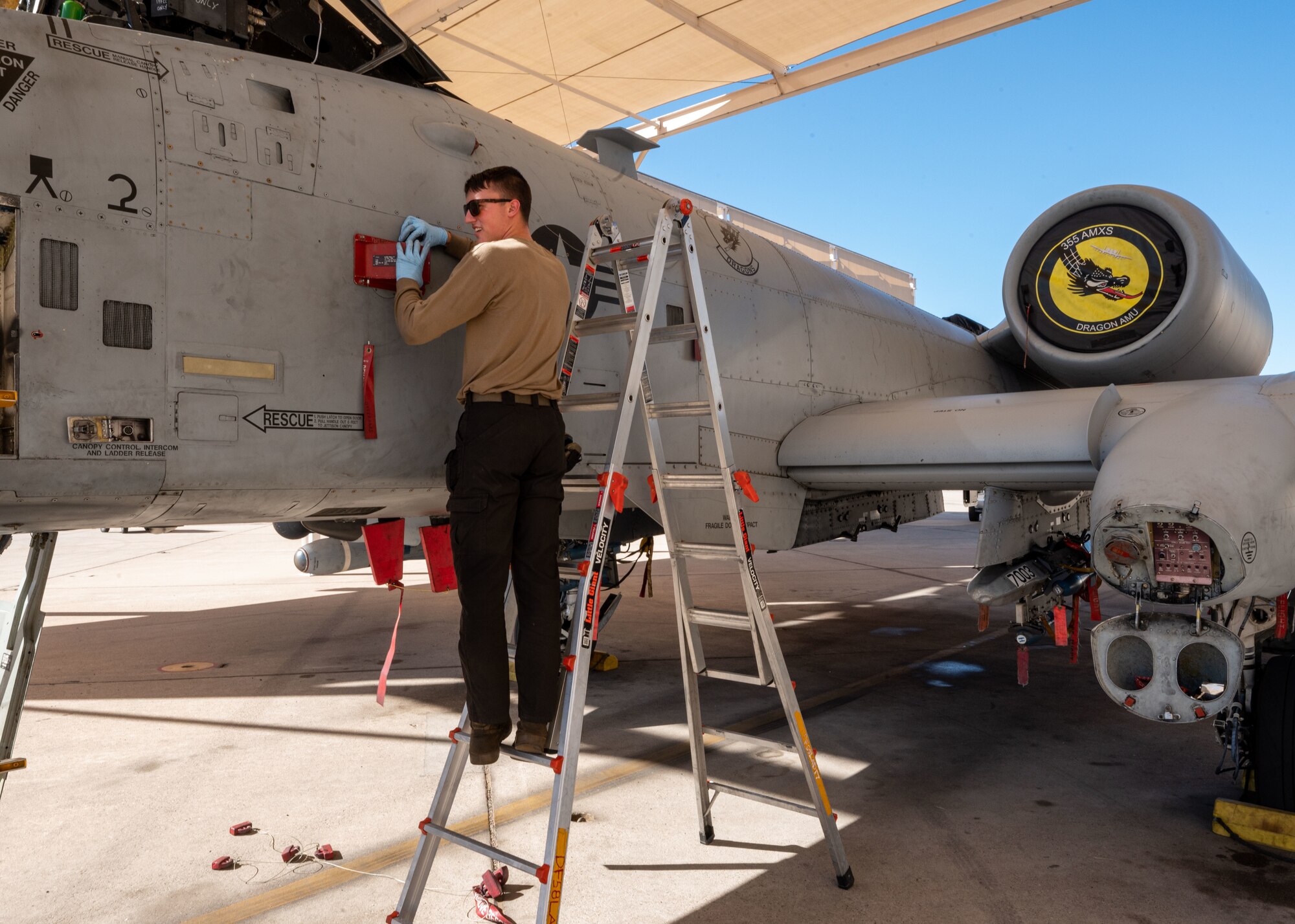 U.S. Air Force Senior Airman Carter Wedding, 357th Fighter Generation Squadron crew chief, checks protective covers on an A-10C Thunderbolt II aircraft at Davis-Monthan Air Force Base, Ariz., Oct. 3, 2023. Wedding checked hydraulic systems before the plane was cleared for takeoff. (U.S. Air Force photo by Airman 1st Class Robert Allen Cooke III)