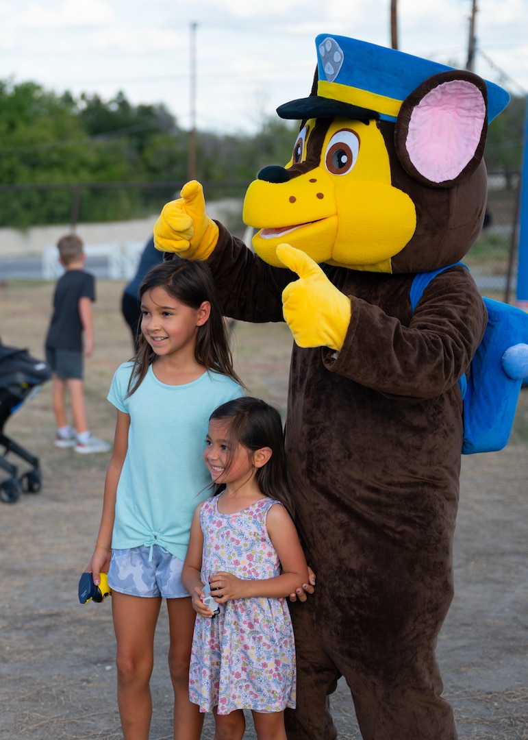 Two children with mascot
