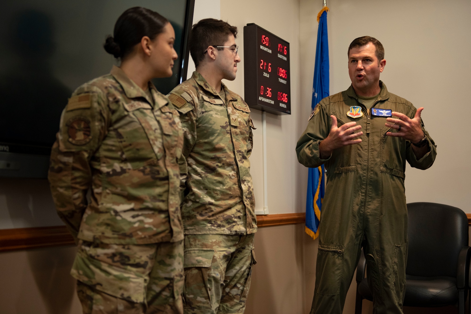 U.S. Air Force Col. Paul Sheets, 23rd Wing commander, recognizes two 23rd Contracting Squadron Airmen during a Red Carpet Committee annual closeout appreciation meal at Moody Air Force Base, Georgia, Sept. 30, 2023. During the meal, 23rd Wing leadership recognized Airmen and Department of Defense civilians for their hard work. (U.S. Air Force photo Staff Sgt. Thomas Johns)