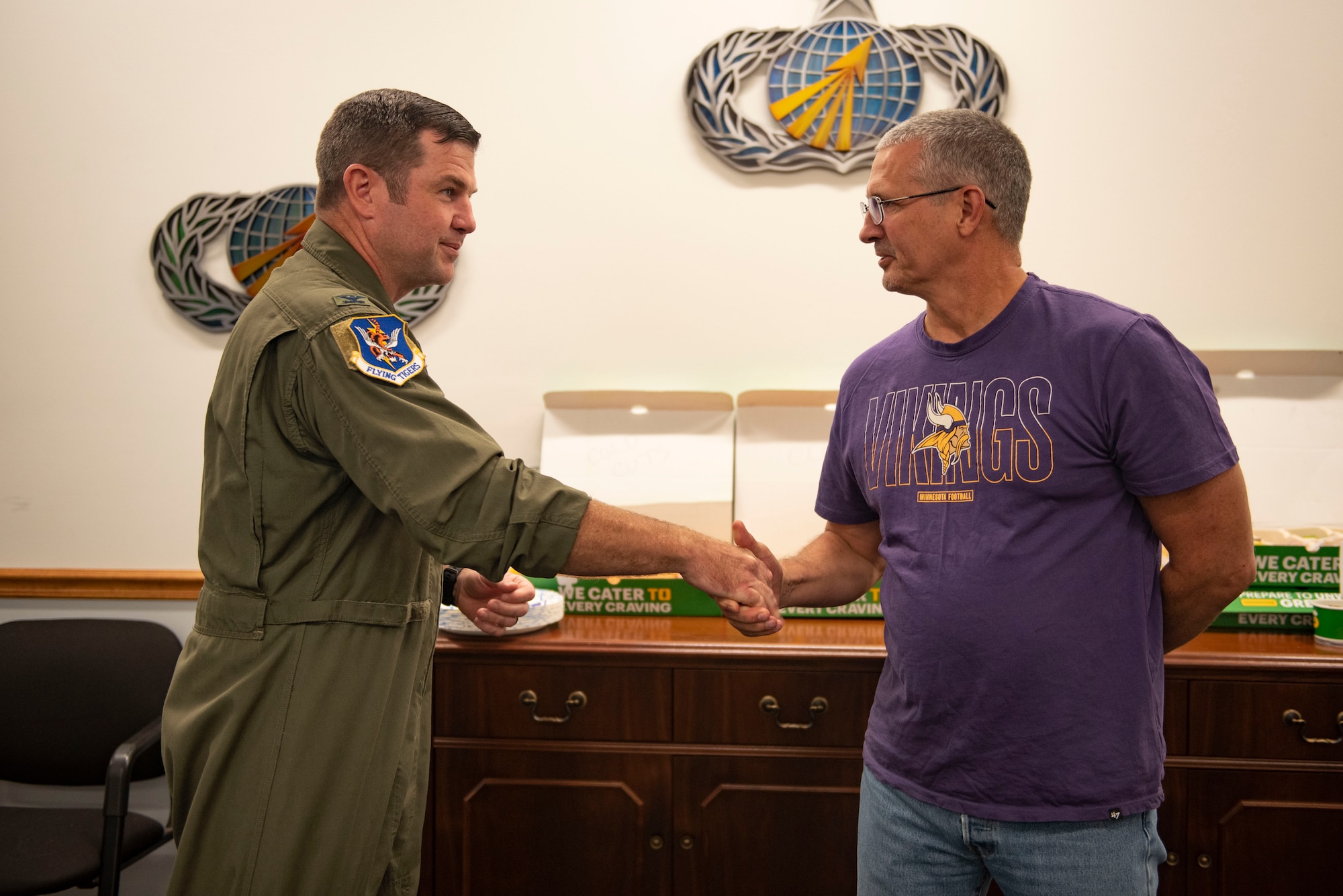 U.S. Air Force Col. Paul Sheets, 23rd Wing commander, recognizes a member of the 23rd Comptroller Squadron during a Red Carpet Organization Annual Closeout Appreciation meal at Moody Air Force Base, Georgia, Sept. 30, 2023. During the Red Carpet Organization Annual Close-out appreciation meal 23rd Wing leadership recognized Airmen and Department of Defense civilians for their hard work. (U.S. Air Force photo Staff Sgt. Thomas Johns)