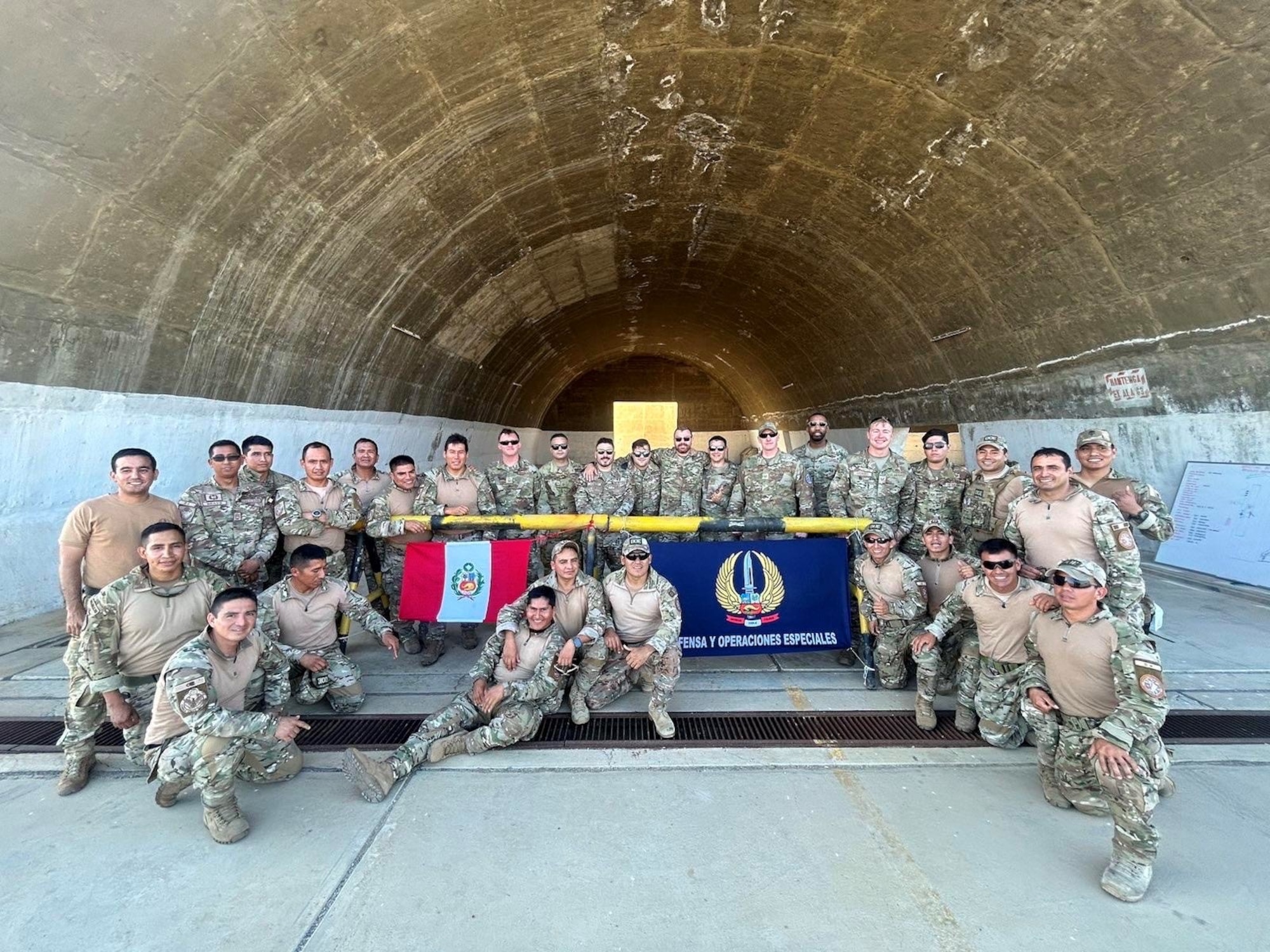 The 412th Operations Support Squadron from Edwards AFB takes a photo with Peruvian Armed Forces on a C-130 during the Resolute Sentinel 2023 exercise in July of 2023 in Peru. With a focus on combining combat training and civil-military operations, Resolute Sentinel 2023 serves as a vital platform to enhance cooperation between the U.S. and its partner nations.  (U.S. Air Force photo by 412th OSS)