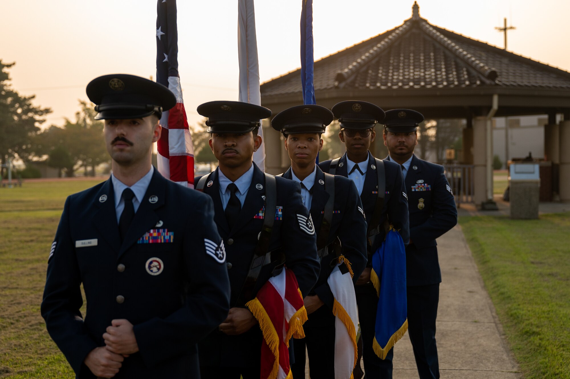 Honor Guard service members prepare for the 24-hour POW-MIA remembrance run closing ceremony.