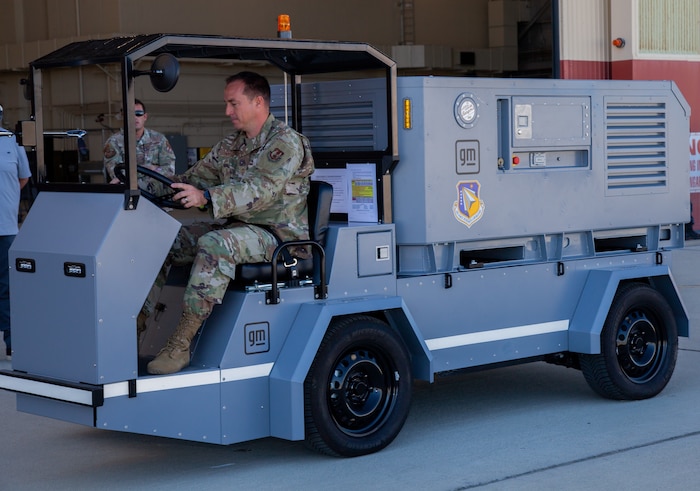 Chief Master Sgt. Darl Parvin Jr. takes the Electric Ground Power Unit and Cart for a test drive at Edwards Air Force Base, Calif., Aug. 14-17, 2023. Flightline aviation ground support equipment and vehicles are critical to the Department of the Air Force military aircraft operations, both stateside and in deployment settings. (U.S. Air Force photo / Carla Escamilla, 412th Test Wing Public Affairs)