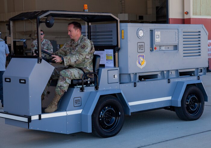 Chief Master Sgt. Darl Parvin Jr. takes the Electric Ground Power Unit and Cart for a test drive at Edwards Air Force Base, Calif., Aug. 14-17, 2023. Flightline aviation ground support equipment and vehicles are critical to the Department of the Air Force military aircraft operations, both stateside and in deployment settings. (U.S. Air Force photo / Carla Escamilla, 412th Test Wing Public Affairs)