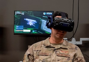 TSgt Daniel Gonzalez, an AC-130 Special Missions Aviator Training Manager, tests out an AC-130J module of the “Virtual Hangar” technology. With a comprehensive XR Training Framework in place, AFSOC is poised to transform its training methodologies, ensuring that Air Commandos are better prepared and equipped for strategic competition. (U.S. Air Force photo by Staff Sgt. Caleb Pavao)