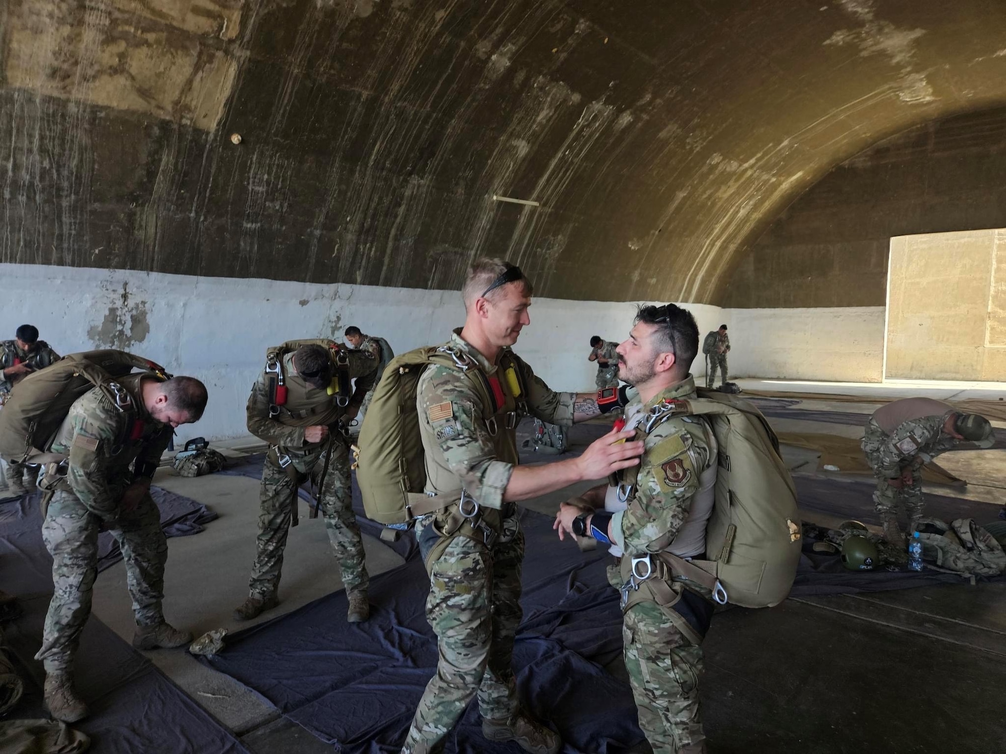 Tech. Sgt. Robert Gregory, SERE Flight Chief, 412th OSS performs an equipment check on a fellow Airman during the Resolute Sentinel 2023 exercise in July of 2023. Resolute Sentinel 2023, held in Peru, provides joint training and improved readiness for U.S. and partner nation civil engineers, medical professionals, and support personnel through humanitarian assistance activities. (U.S. Air Force photo by 412th OSS)