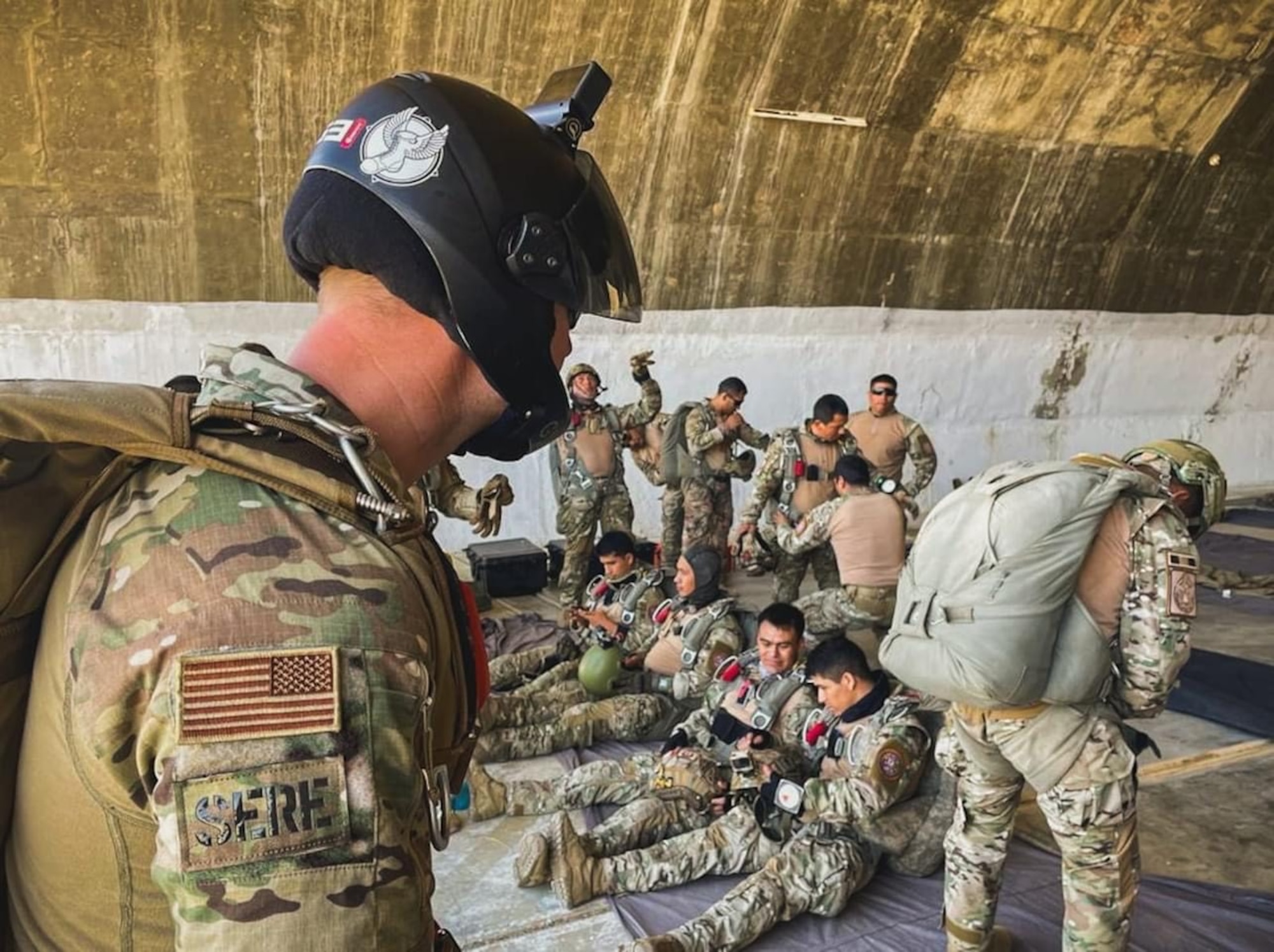 Tech. Sgt. Robert Gregory, SERE Flight Chief, 412th OSS oversees an equipment check with the Peruvian Armed Forces during the Resolute Sentinel 2023 exercise in July of 2023 in Peru. The exercise included intensive training and coordination between American and Peruvian parachutists. (U.S. Air Force photo by 412th OSS)