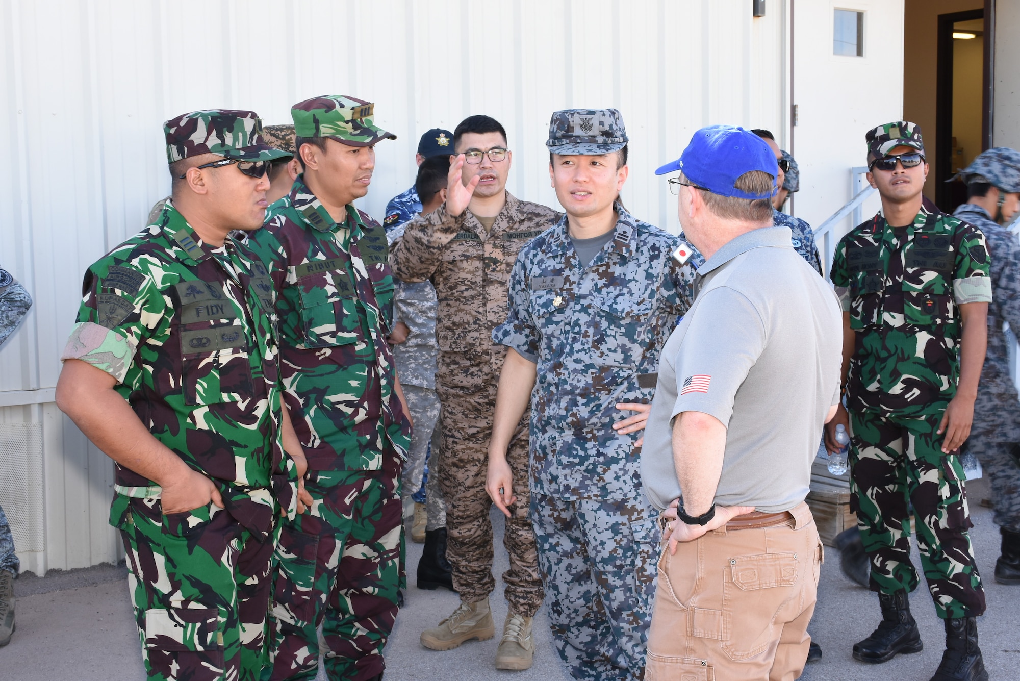 Japan Air Self-Defense Force Maj. Yamaura Masafuni talks with Bernard Willi, from the Joint Ballistic Missile Training and Education Center, and members of the Indonesian Air Force on the McGregor Range, El Paso, Texas, September 25-30, 2023. (Courtesy photo)