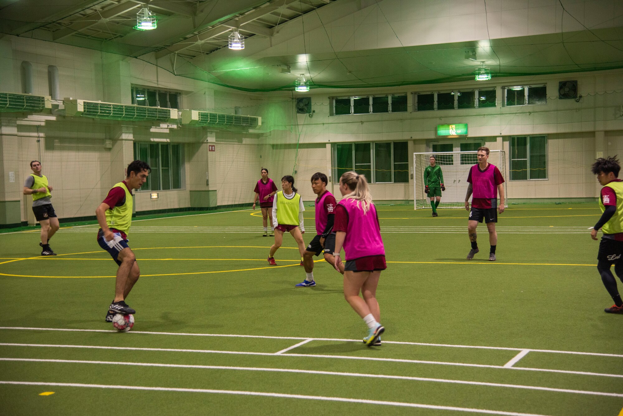 A group of soccer players practice at an indoor soccer field in Misawa.